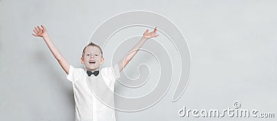 Cheerful kid with hands up Stock Photo