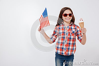 Cheerful little girl celebrating American national holiday Stock Photo