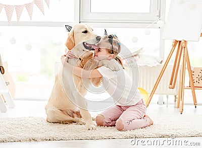 Cheerful little girl with cute dog Stock Photo