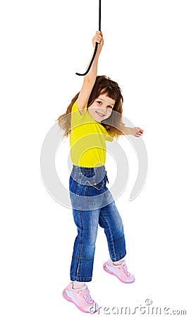 Cheerful little girl hanging on a rope Stock Photo