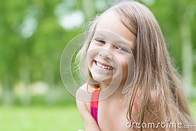Cheerful little girl in the park Stock Photo