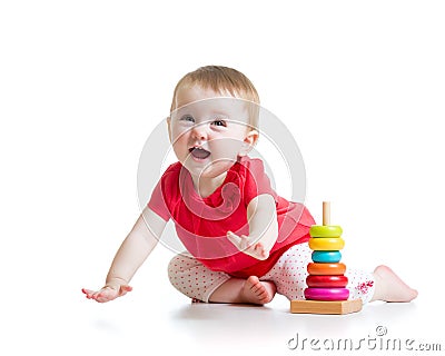 Cheerful little girl playing with colorful toy Stock Photo