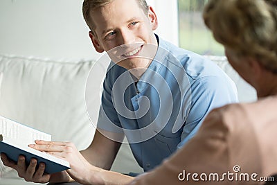 Cheerful male caregiver Stock Photo