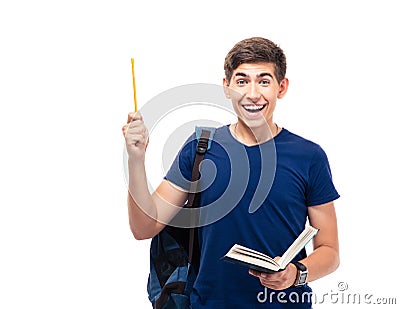 Cheerful male student holding book and pencil Stock Photo