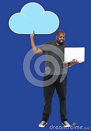 Cheerful man holding online cloud storage symbols Stock Photo