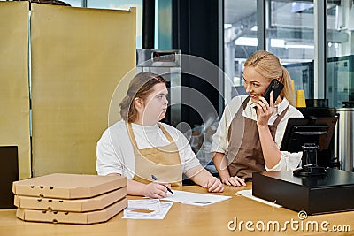 cheerful manager talking on smartphone near Stock Photo