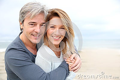 Cheerful mature couple on the beach Stock Photo