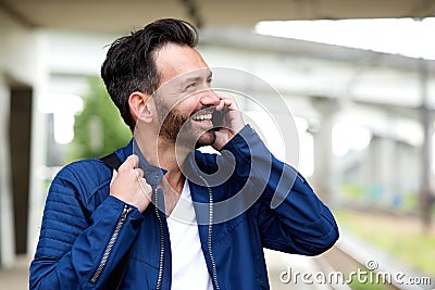 Cheerful mature man talking on mobile phone Stock Photo