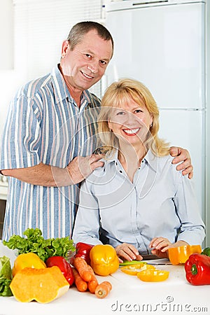 Cheerful mature man and woman smiling together Stock Photo