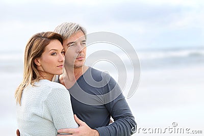 Cheerful middle-aged couple by the beach Stock Photo