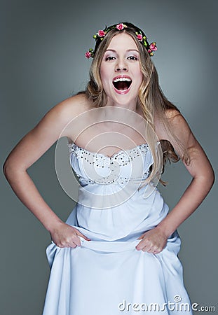 Cheerful model in white dress Stock Photo