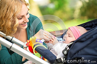 Cheerful mother with her baby Stock Photo