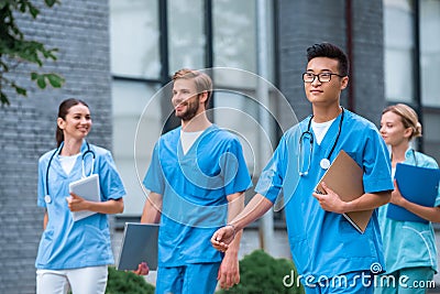 cheerful multicultural medical students walking Stock Photo