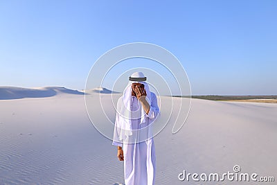 Young male emirate rejoices in life and walks through expanses o Stock Photo