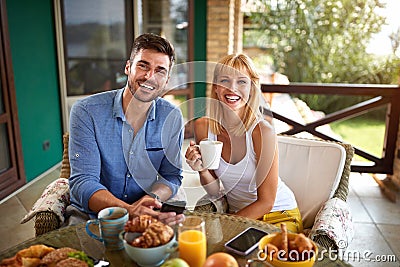 Cheerful pair having breakfast Stock Photo