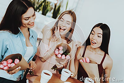 Cheerful People in Day 8 March. Charming Beautiful Girls Celebrate Day 8 March. Care about beautiful Girl. Bouquet With Besutiful Stock Photo