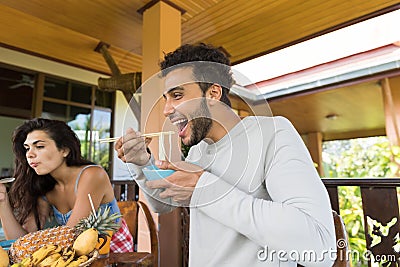 Cheerful People Tasting Asian Noodles Eating With Chopsticks Together Friends Meeting And Communicating Stock Photo