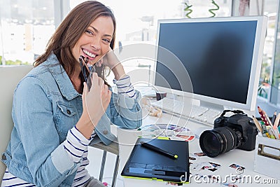 Cheerful photo editor with a graphic tablet Stock Photo