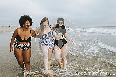 Cheerful plus size women enjoying the beach Stock Photo