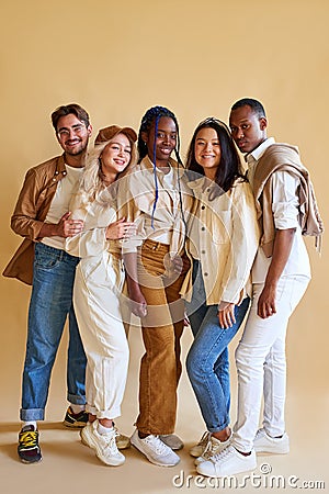 Cheerful positive group of young people of diverse nationalities posing at camera Stock Photo