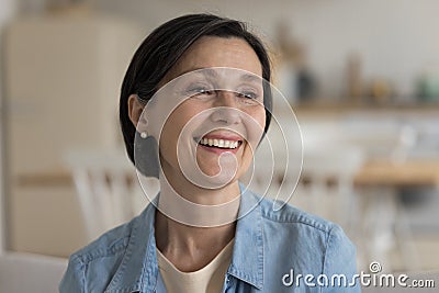 Cheerful positive pretty mature lady candid face portrait Stock Photo