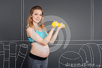 Cheerful pregnant woman enjoying sport Stock Photo