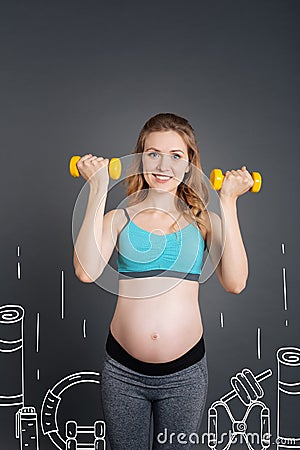 Cheerful pregnant woman going in for sport Stock Photo