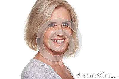 Cheerful pretty old lady is smiling. Skin and tooth care Stock Photo