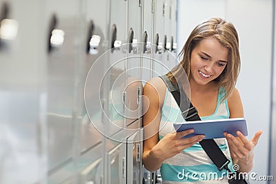 Cheerful pretty student using tablet Stock Photo