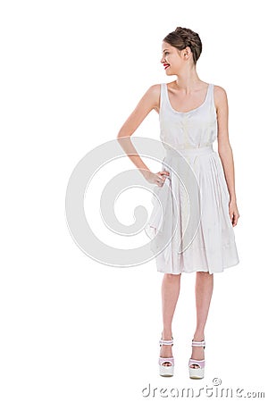 Cheerful pretty woman in white dress posing Stock Photo