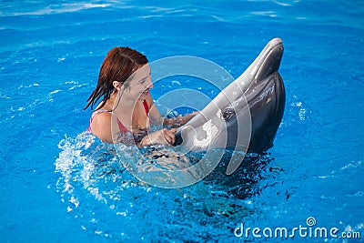 Woman and dolphin Stock Photo