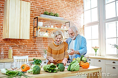 Senior couple with healthy food at home Stock Photo