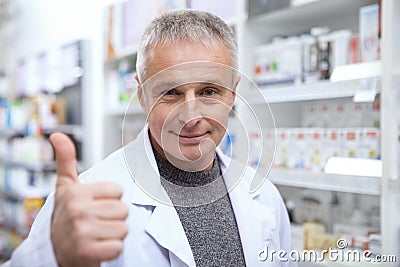 Mature pharmacist helping his female customer Stock Photo