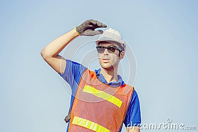 Cheerful shipping company workers working at the harbor, Engineering man looking to the sky Stock Photo