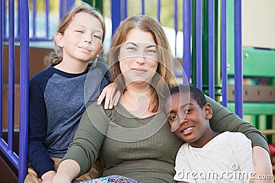 Cheerful single mom with sons outside Stock Photo