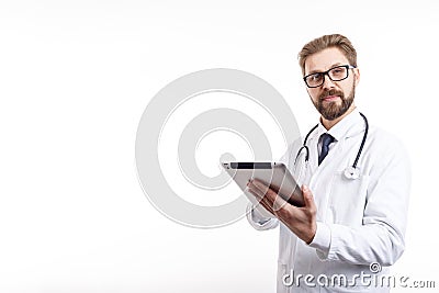 Cheerful Slightly Smiling Bearded Doctor With Tablet and Stethoscope Stock Photo