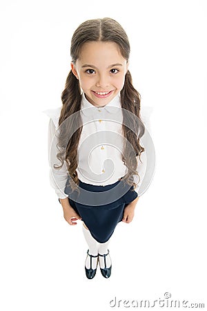 Cheerful smile. Girl cute pupil on white background. School uniform. Back to school. Student little kid adores school Stock Photo