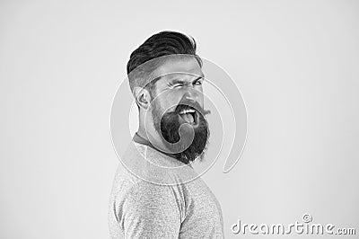 Cheerful smile. Man bearded hipster with mustache. Beard mustache grooming guide. Hipster handsome bearded guy yellow Stock Photo