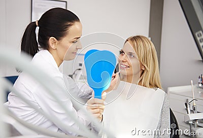 Cheerful stomatologist examining woman`s teeth Stock Photo