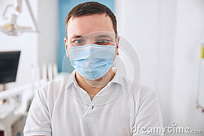 Portrait of kind male person that enjoying his job Stock Photo