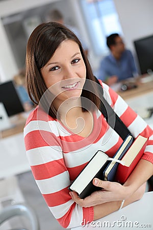 Cheerful student woman in class Stock Photo