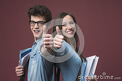 Cheerful students thumbs up Stock Photo