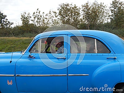 VINTAGE BLUE CAR ON THE HIGHWAY, CUBA Editorial Stock Photo