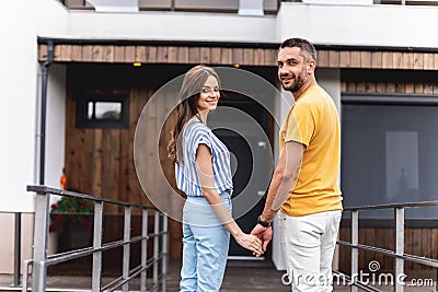 Cheerful twosome looking at camera with wide smile Stock Photo