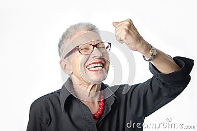 Cheerful winning senior woman Stock Photo