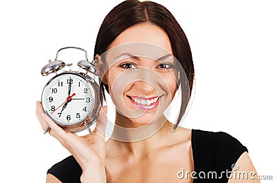 Cheerful woman with alarm clock Stock Photo