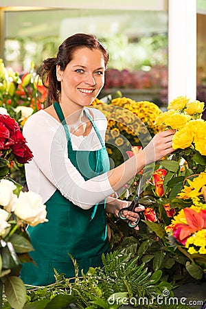Cheerful woman flower shop market choosing working Stock Photo