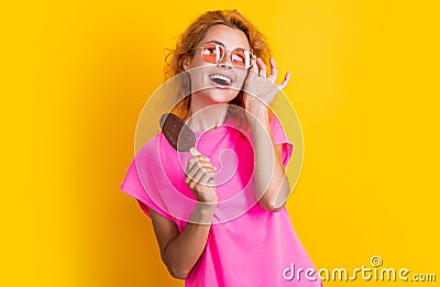 cheerful woman with icelolly ice cream isolated on yellow. woman with icelolly ice cream Stock Photo