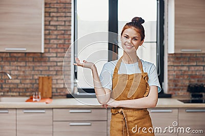 cheerful woman kitchen apartment kitchen utensils interior household concept Stock Photo