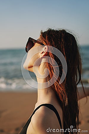 cheerful woman in sunglasses Sandy coast landscape sun Stock Photo